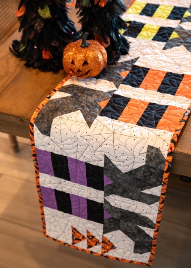 Finished quilt showcasing machine quilting texture